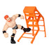 WWE Sheamus Knuckle Crunchers toy posed kicking orange ladder, featuring muscular arms, black boots, trunks, and wristbands designed for bending and wrestling play.