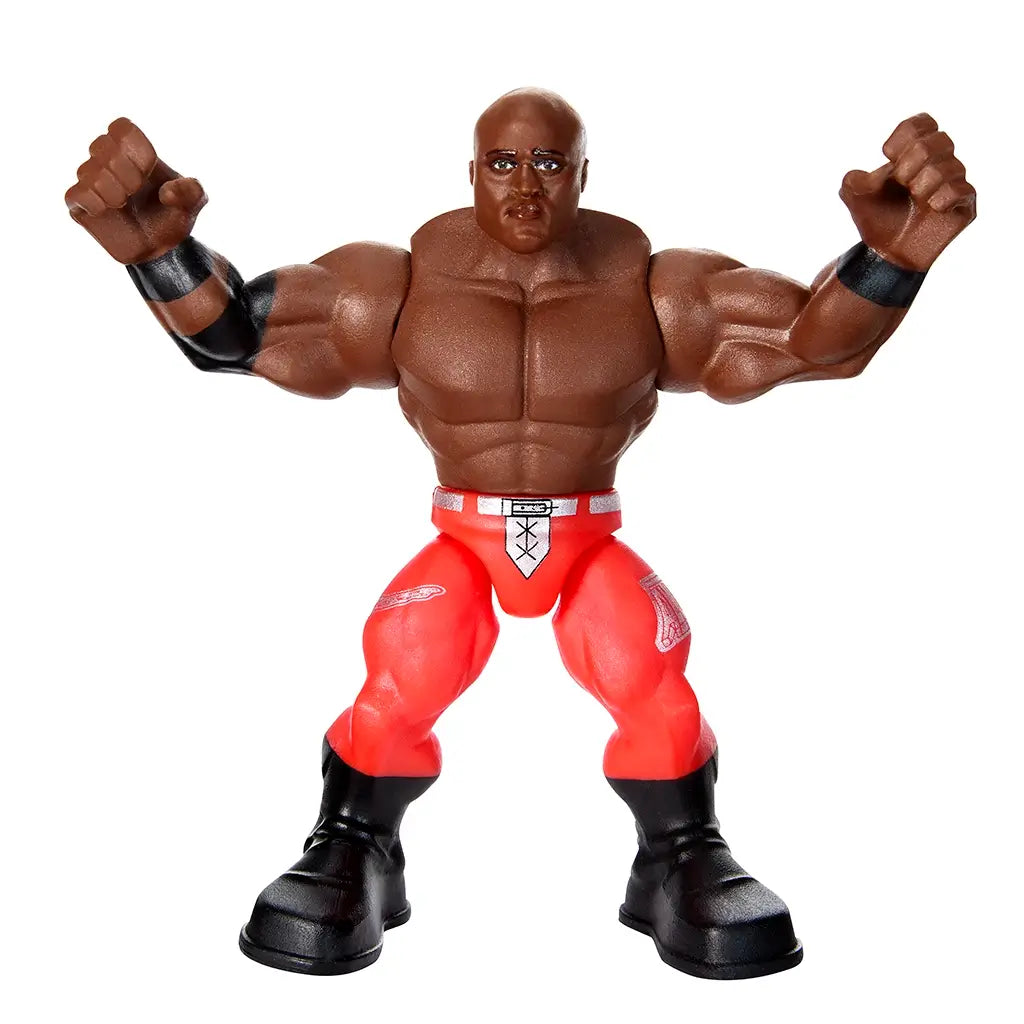 WWE Bobby Lashley Knuckle Crunchers toy figure with muscular brown plastic body, red wrestling pants, black boots, and raised fists in a power pose.