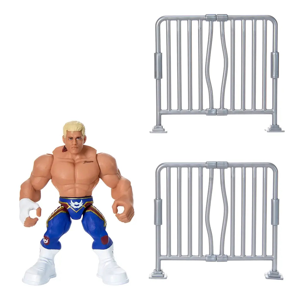 Cody Rhodes WWE Knuckle Crunchers figure displayed with two gray barricade accessories, featuring blue tights, muscular build, and white boots for realistic wrestling play.