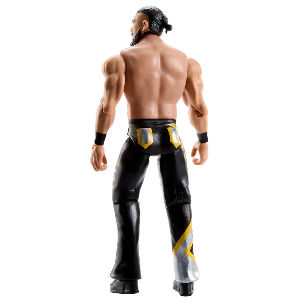 WWE Main Event Series Andrade wrestling figure rear angled view showing sculpted back muscles, black pants with yellow detailing, tied-back molded hair, articulated shoulders and hips, black boots, and clean white product photography setting.