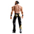 WWE Main Event Series Andrade wrestling figure rear angled view showing sculpted back muscles, black pants with yellow detailing, tied-back molded hair, articulated shoulders and hips, black boots, and clean white product photography setting.