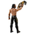 WWE Seth Rollins action figure is viewed from behind holding a detailed championship belt aloft, revealing sculpted back muscles, black-and-gold tights, and articulated boots on a white studio background.