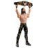 WWE action figure of Seth Rollins in black-and-gold gear lifts a detailed championship belt overhead, showing smooth plastic texture, articulated limbs, and bold sculpting on a white background.