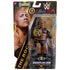 WWE Main Event Series The Rock figure appears in retail packaging, showing the action figure posed with a gold-trimmed championship belt inside a clear display window against bold branded card art.