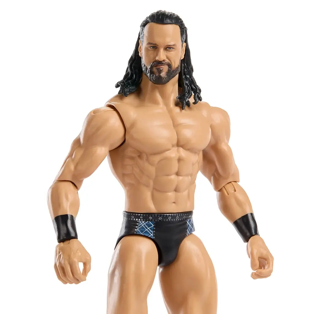 WWE Drew McIntyre wrestling figure close-up showing detailed facial sculpt with beard and long hair, defined chest and arm muscles, tan plastic finish, black wristbands, and articulated shoulders for realistic display and play.