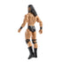 WWE Drew McIntyre action figure rear angled view highlighting sculpted back muscles, long black hair detail, black trunks, knee supports, and boots, with articulated joints designed for dynamic wrestling poses and collector display.