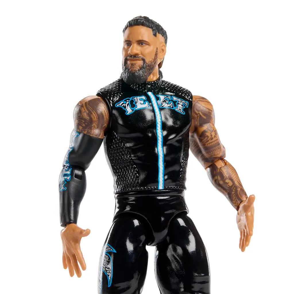WWE Jey Uso wrestling figure close-up showing black textured vest with blue accents, detailed facial sculpt with beard and short hair, brown skin tone, tattooed arms, and articulated joints for realistic display and play.