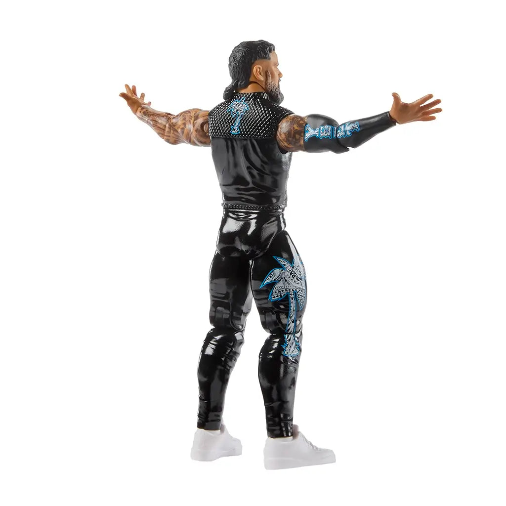 WWE Jey Uso action figure rear angled view highlighting black glossy pants, sleeveless vest with blue design on the back, detailed arm tattoos, long hair sculpt, and flexible joints designed for dynamic wrestling poses.