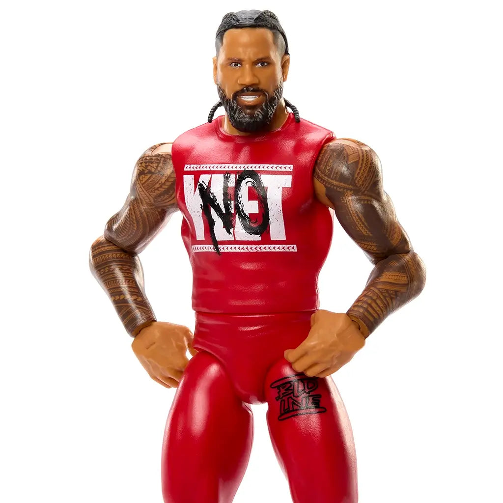Close-up of WWE Main Event Series Jimmy Uso action figure highlighting facial sculpt, braided hair, beard, detailed arm tattoos, and red “NOT” chest design on a white background.