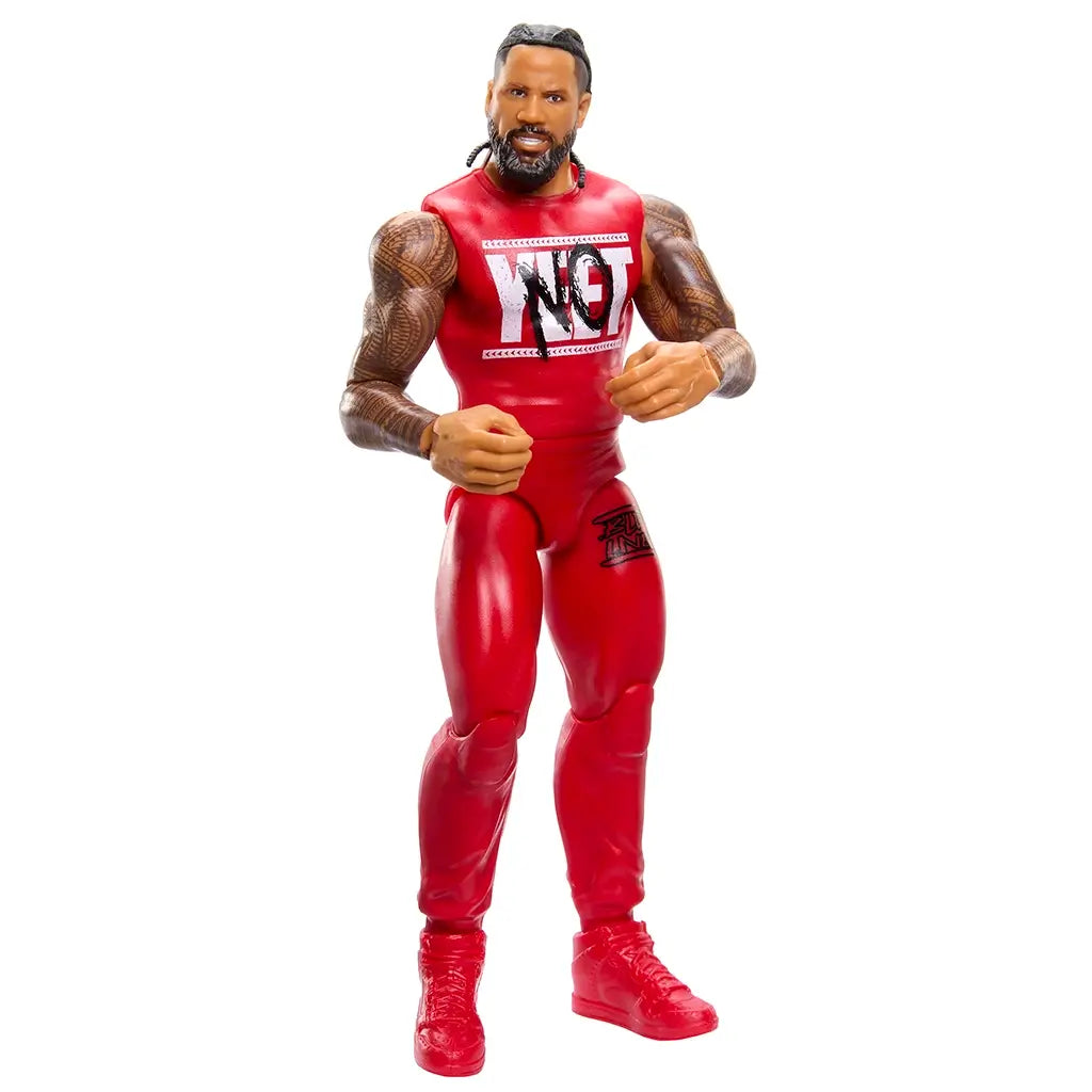 WWE Main Event Series Jimmy Uso wrestling figure posed dynamically to demonstrate articulation, wearing red gear with tattooed arms on a white studio background.