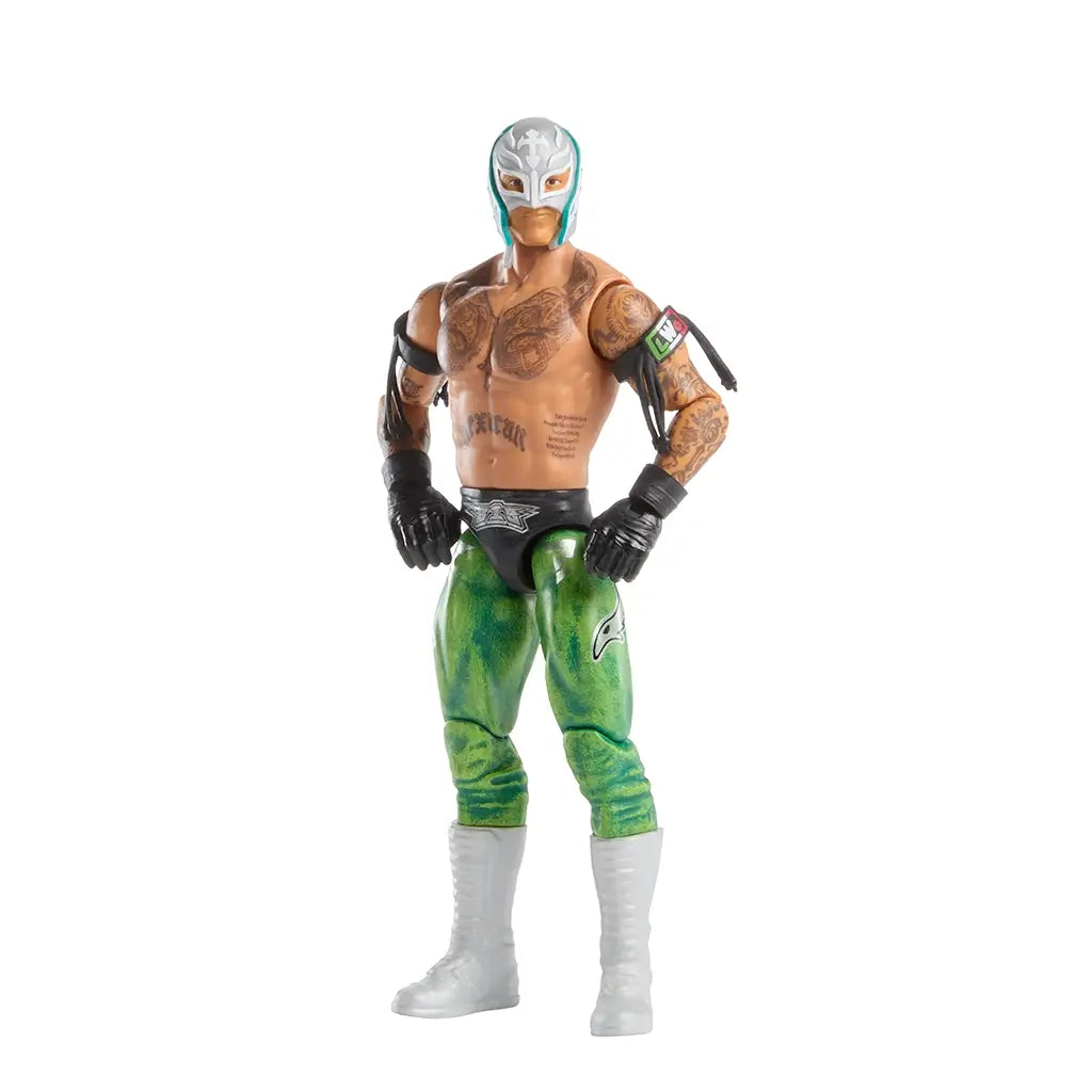 WWE Rey Mysterio poseable action figure standing with hands on hips, featuring green and black tights, silver mask, tattooed torso, white boots, and flexible joints that allow dynamic lucha-style wrestling poses.