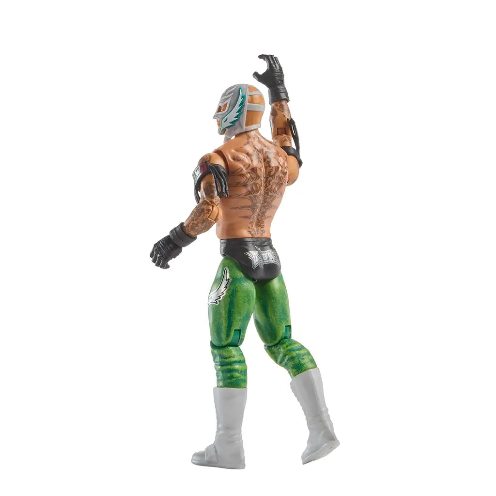 WWE Rey Mysterio action figure rear angled view highlighting intricate back tattoos, green textured tights with white accents, black gloves, white boots, and articulated joints designed for expressive wrestling poses.