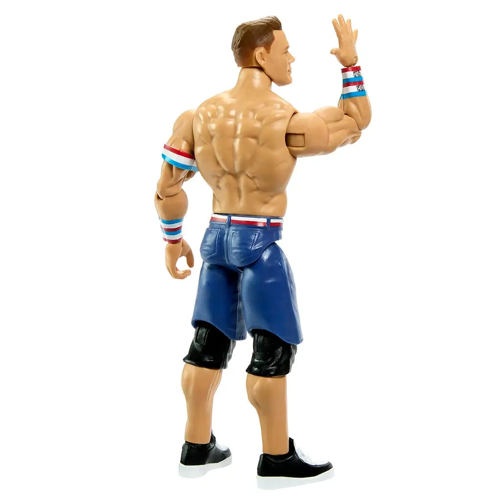 WWE John Cena action figure rear angled view with tan glossy plastic surface, defined sculpted back muscles and articulated limbs, blue shorts and wristbands, emphasizing poseability on a clean white backdrop.