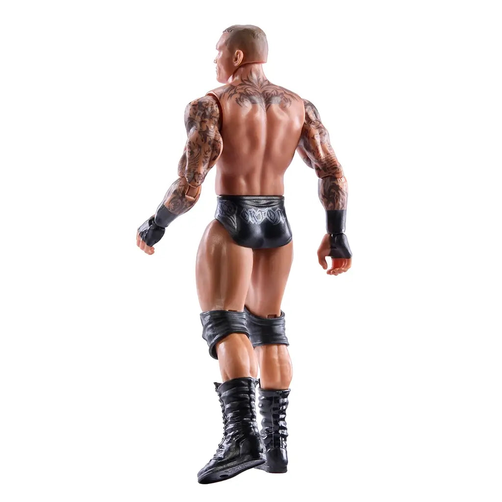 WWE Randy Orton action figure rear angled view showcasing sculpted back muscles, tattooed shoulders and arms, black trunks with silver detailing, knee pads, and articulated legs designed for dynamic wrestling poses and collector display.
