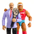 WWE action figures of Hulk Hogan in a red tank top and turquoise trunks with championship belt stand beside Mean Gene Okerlund in a lavender blazer holding the same title belt.