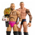 Close-up WWE CM Punk and Randy Orton figures with detailed tattoos, Punk holding golden championship belt, both posed to highlight muscular builds and realistic likeness.
