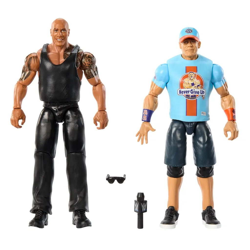 WWE action figures of The Rock and John Cena shown outside the box with included accessories, featuring a black microphone and sunglasses for roleplay wrestling battles.