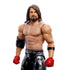 Close-up of Mattel WWE AJ Styles figure highlighting facial features, long hair, muscular torso, and detailed wrestling attire with red gloves and black pants.