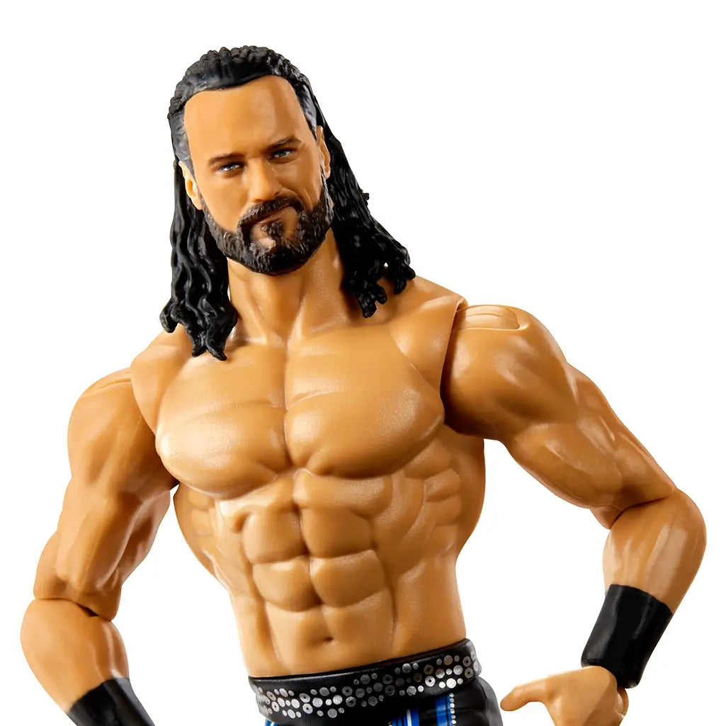 Close-up of Drew McIntyre WWE action figure showcasing detailed facial features, beard, long black hair, and muscular chest with black wristbands.