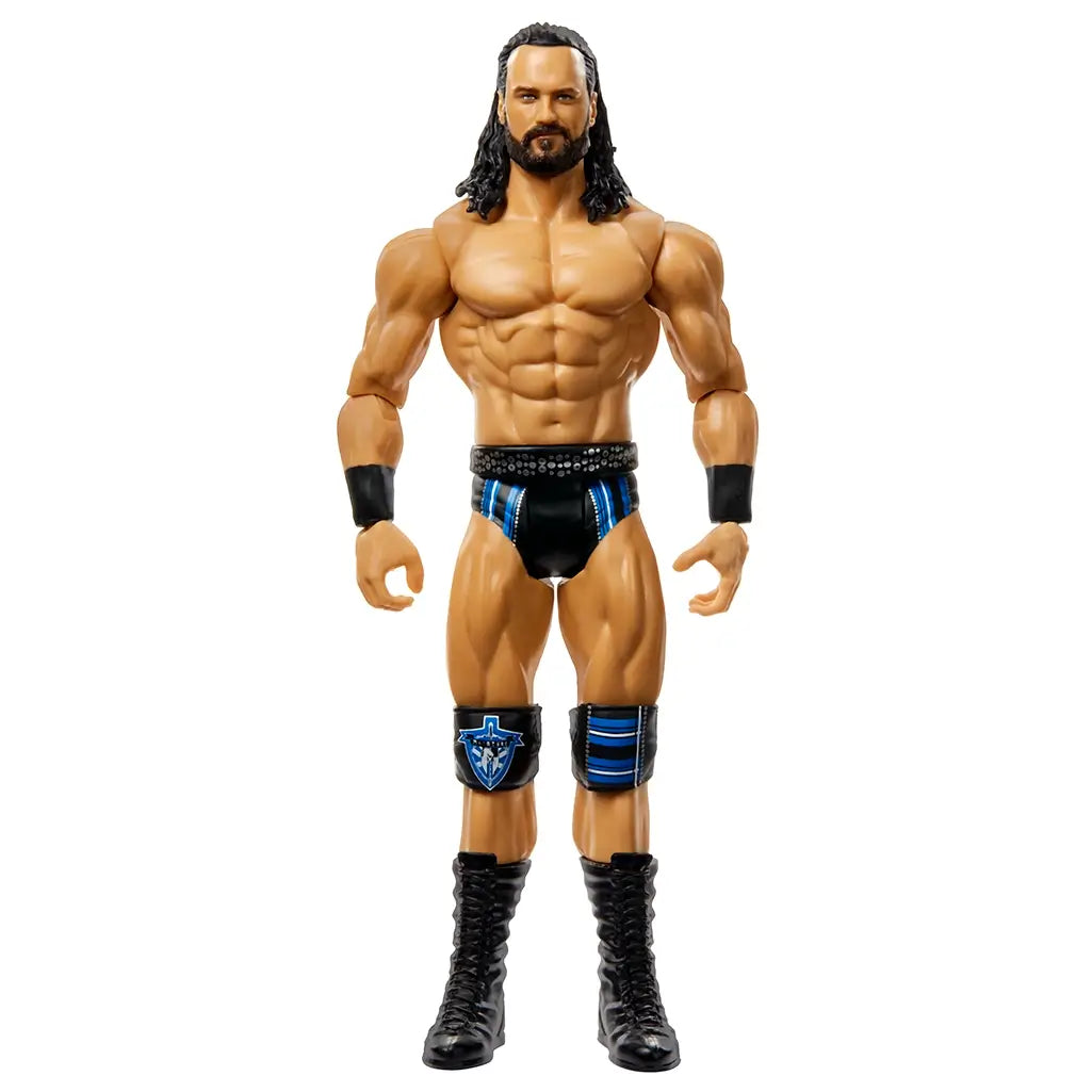 Front view of Drew McIntyre WWE Top Picks action figure in standing pose with detailed muscle sculpt, black and blue ring gear, and tall black boots.