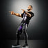 WWE Finn Bálor Ultimate Edition figure striking a pose, dressed in black pants and a printed Judgment Day t-shirt, pointing with detailed tattooed arms and expressive face sculpt.