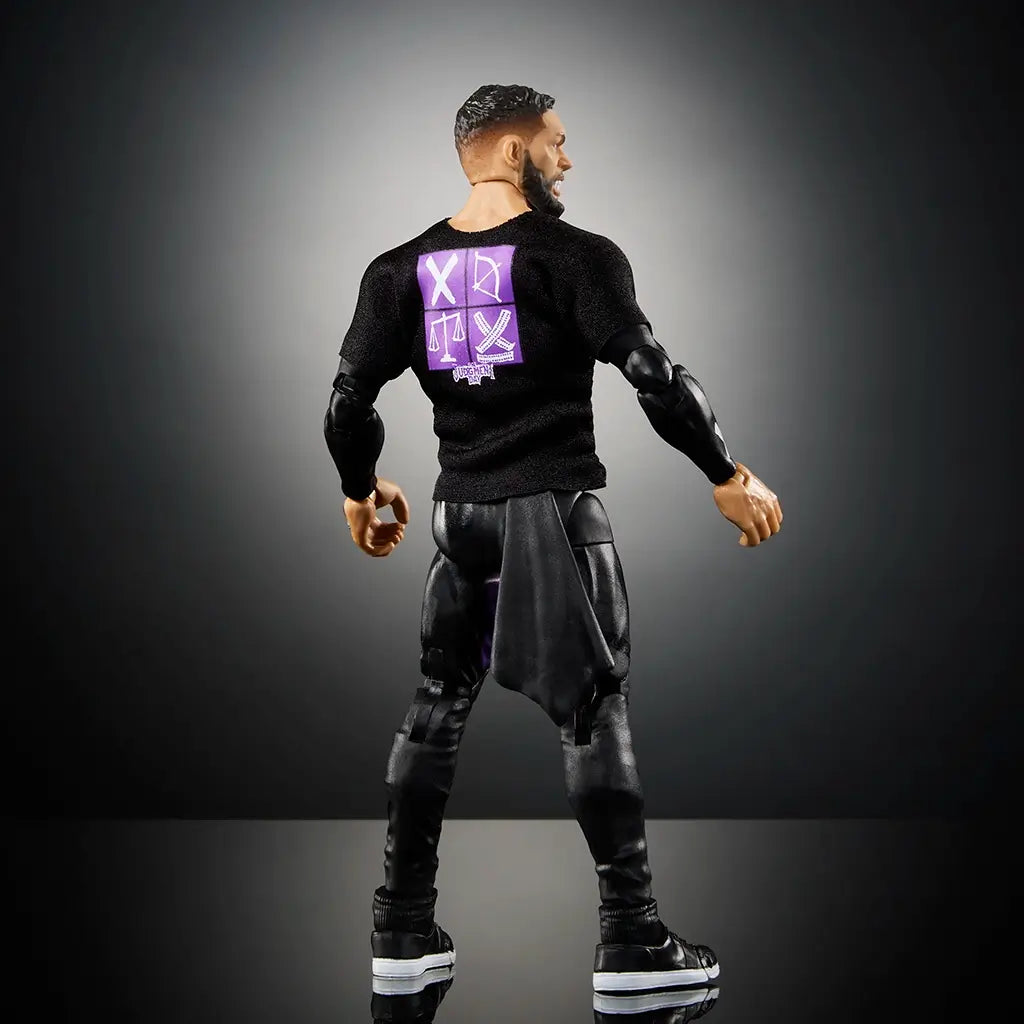 Highly poseable WWE Finn Bálor Ultimate Edition action figure shown from the back, wearing black pants, sneakers, and a black Judgment Day shirt with purple designs.