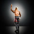 WWE Solo Sikoa action figure rear angle showing muscular build, tattooed arms, black shorts with red tribal graphics, and one finger raised in victory pose on reflective surface.