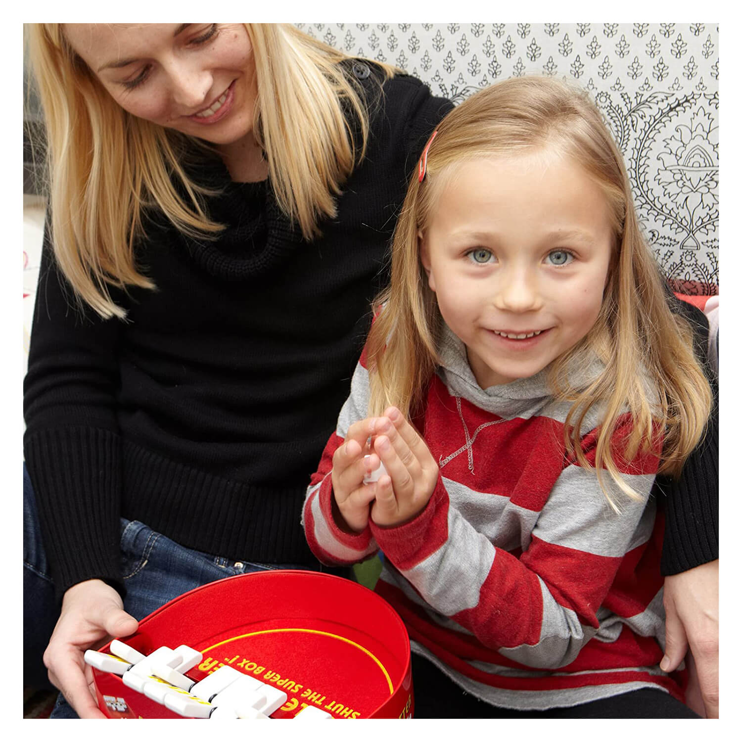 Mother and daughter having fun playing the double shutter game.