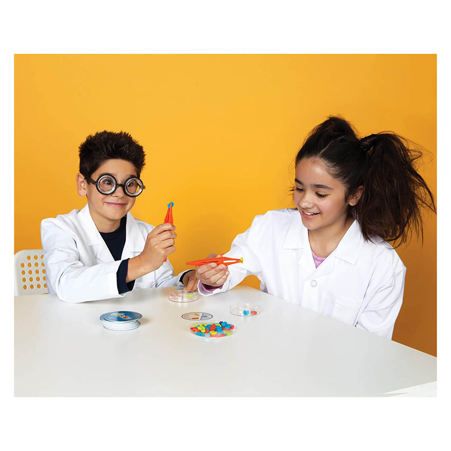 Kids having fun playing the Blue Orange Dr. Microbe Game.