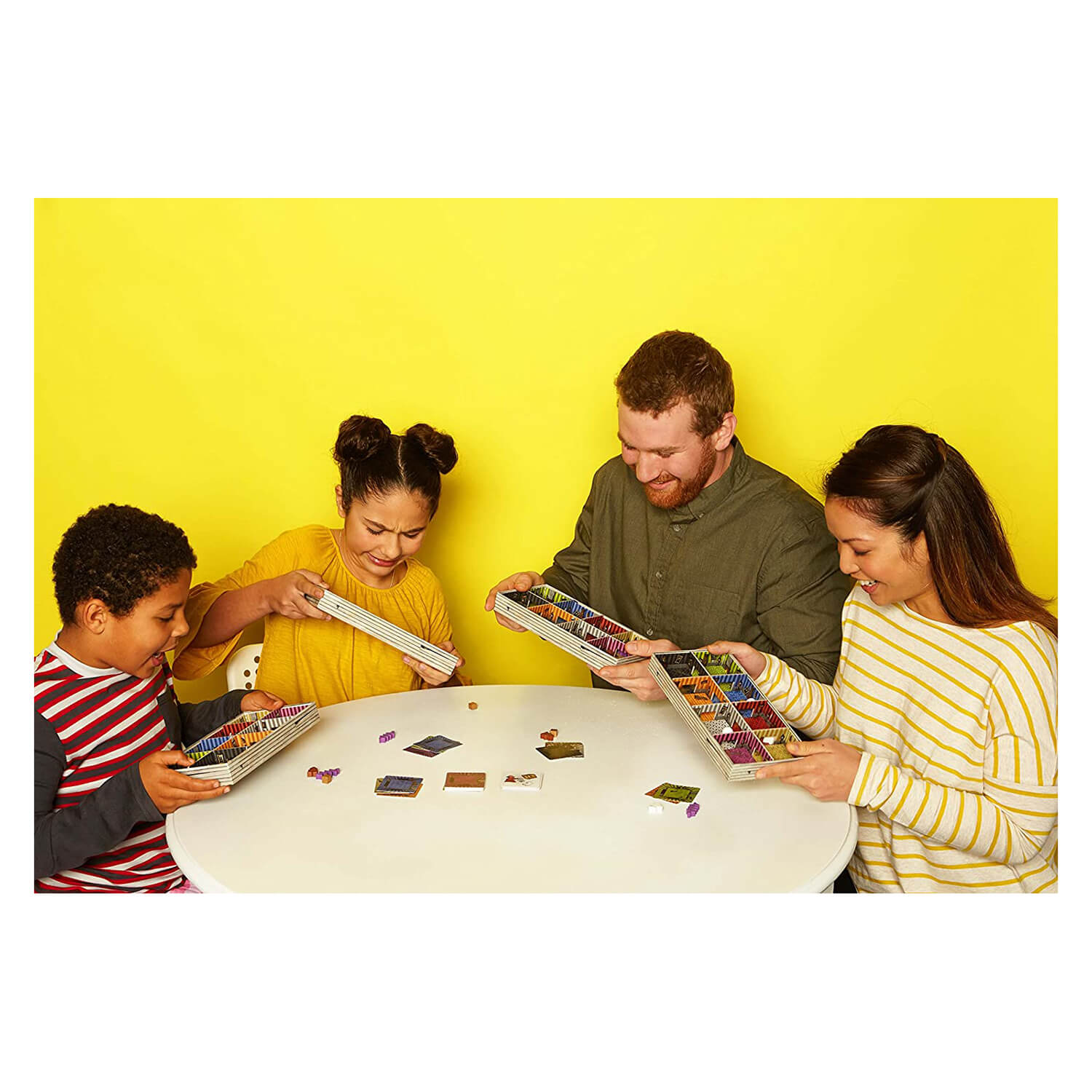 Family playing the shaky manor board game.
