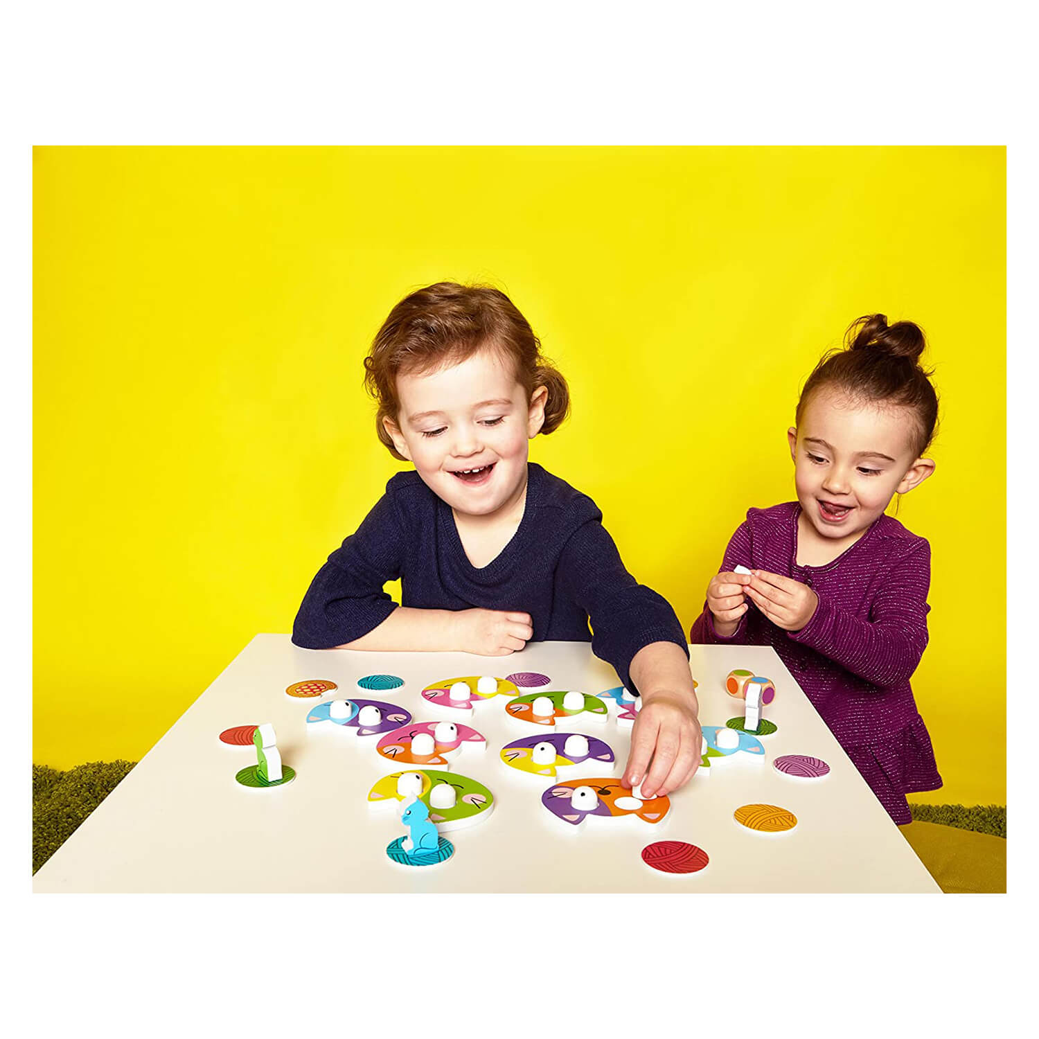 Kids playing the board game.
