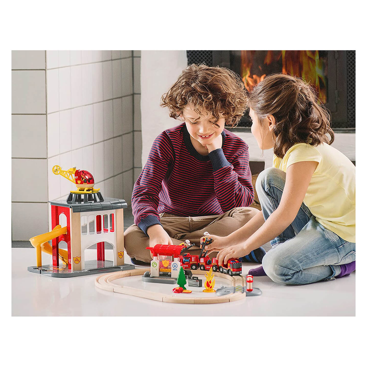 Kids playing with their fire station playset.