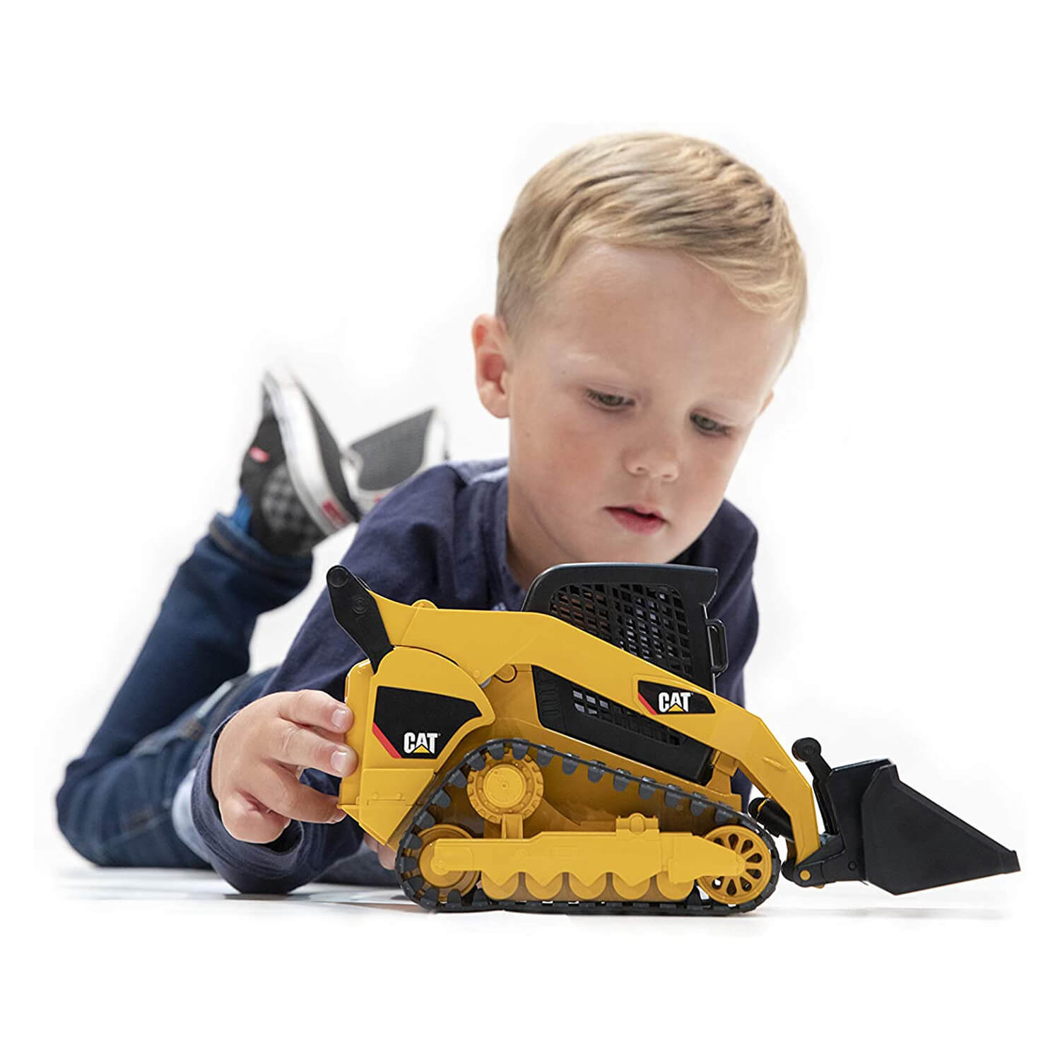 Kid playing with the caterpillar vehicle.