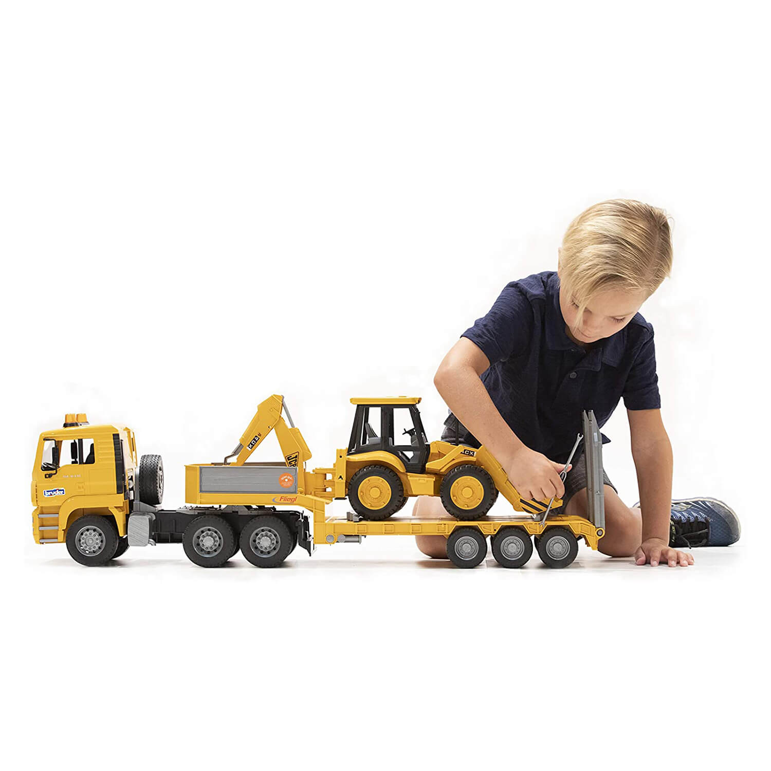Kid playing with the low loader truck.
