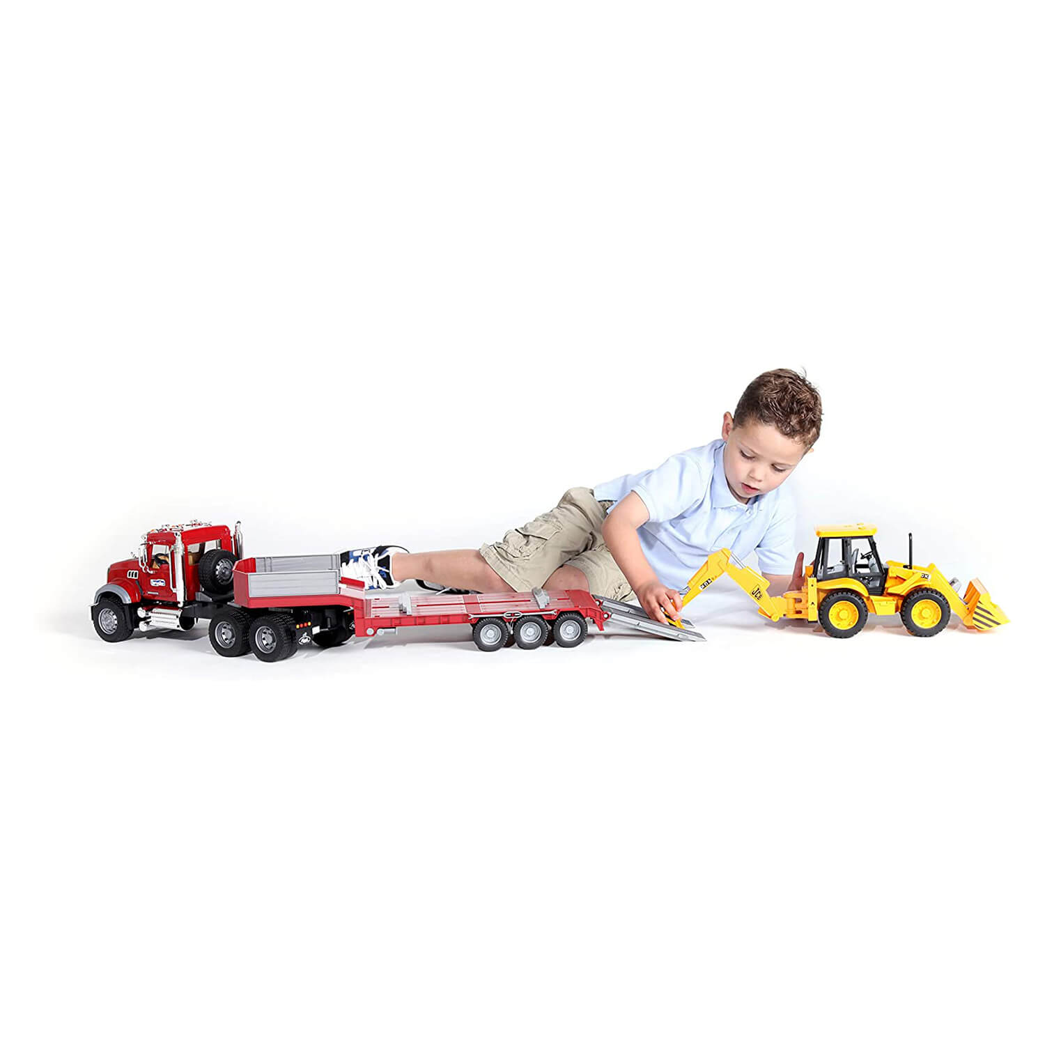 Kid playing with the truck toy.