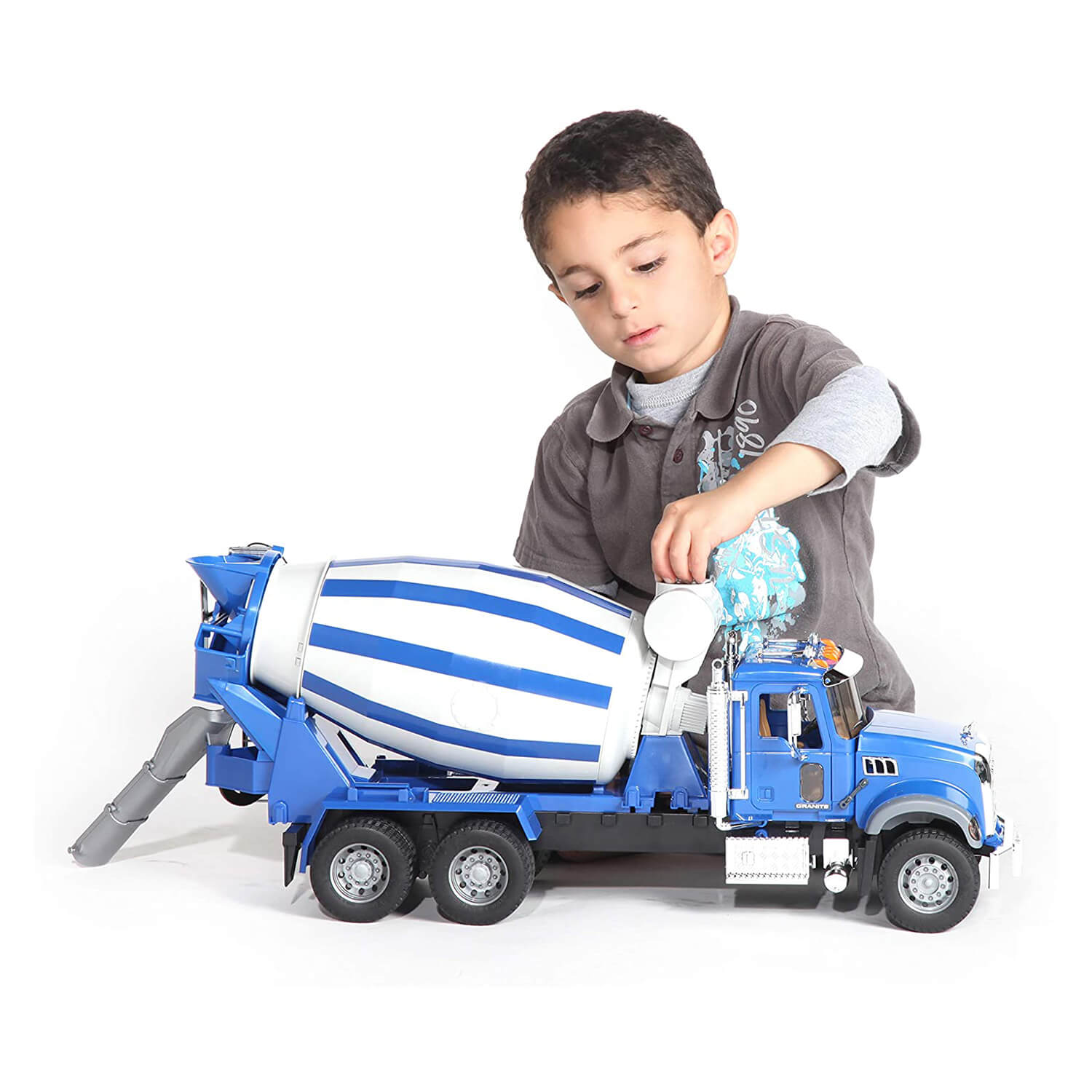 Boy playing with the cement mixer truck toy.