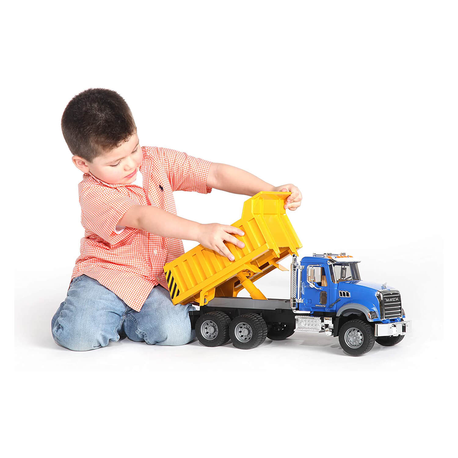 Kid playing with the dump truck.