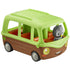 Toy adventure bus playset with bright green plastic roof, smooth brown body, rounded open seating, and small gray owl figure beside it, shown in a clean studio setting for children’s product display.