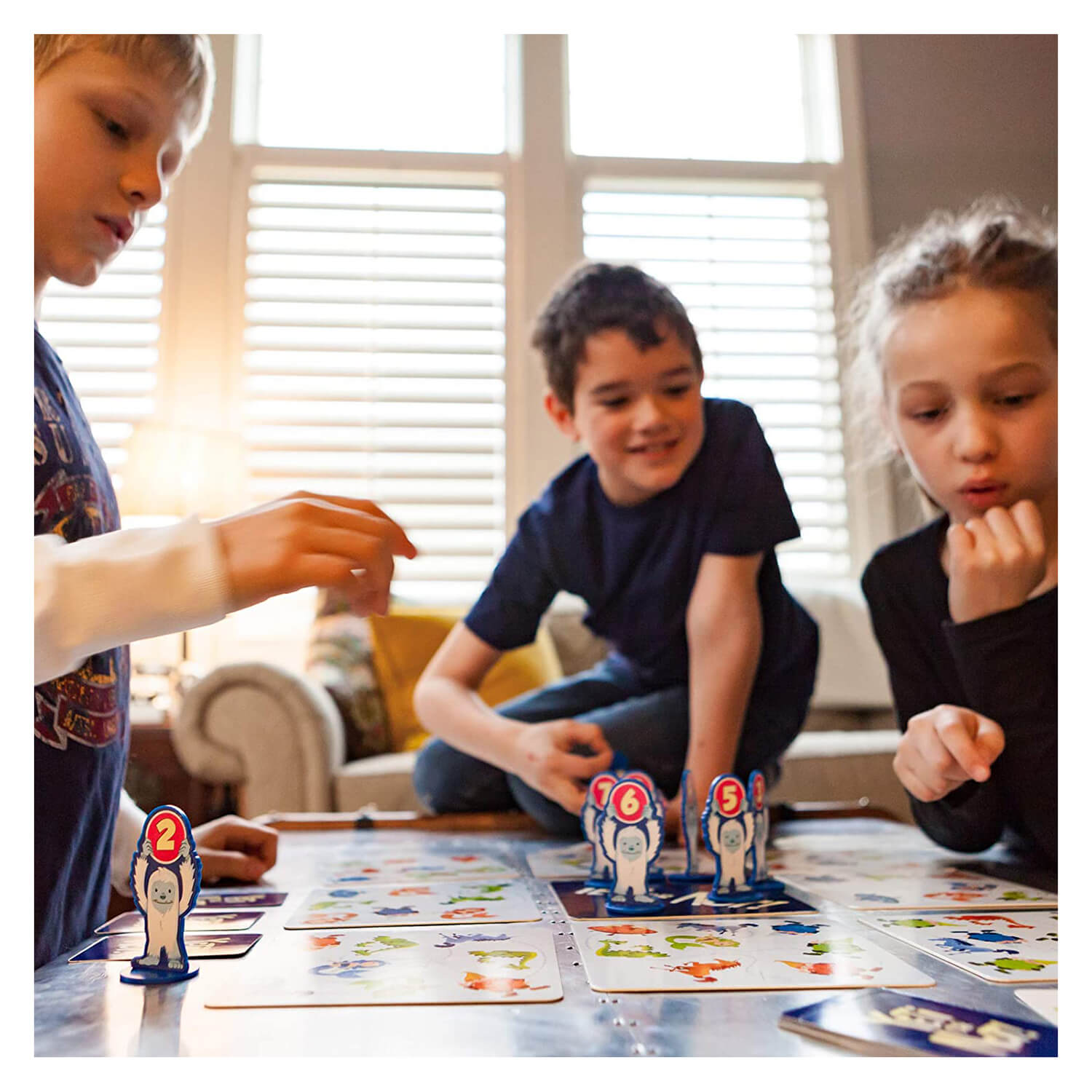 Family play the board game.