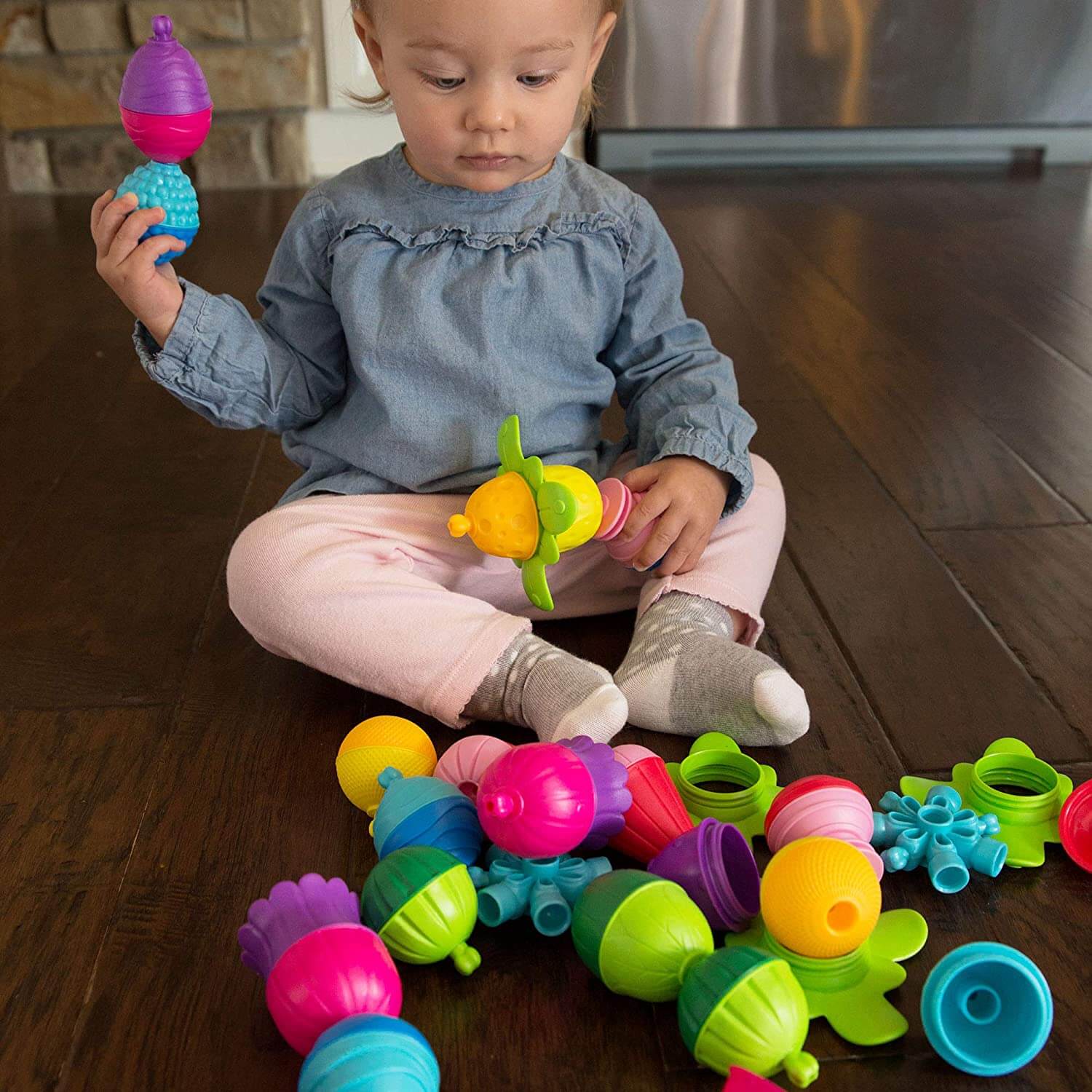 Baby playing with the pieces of the toy.