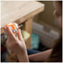 Kid playing with the Fat Brain Toys Shake & Make Dice.