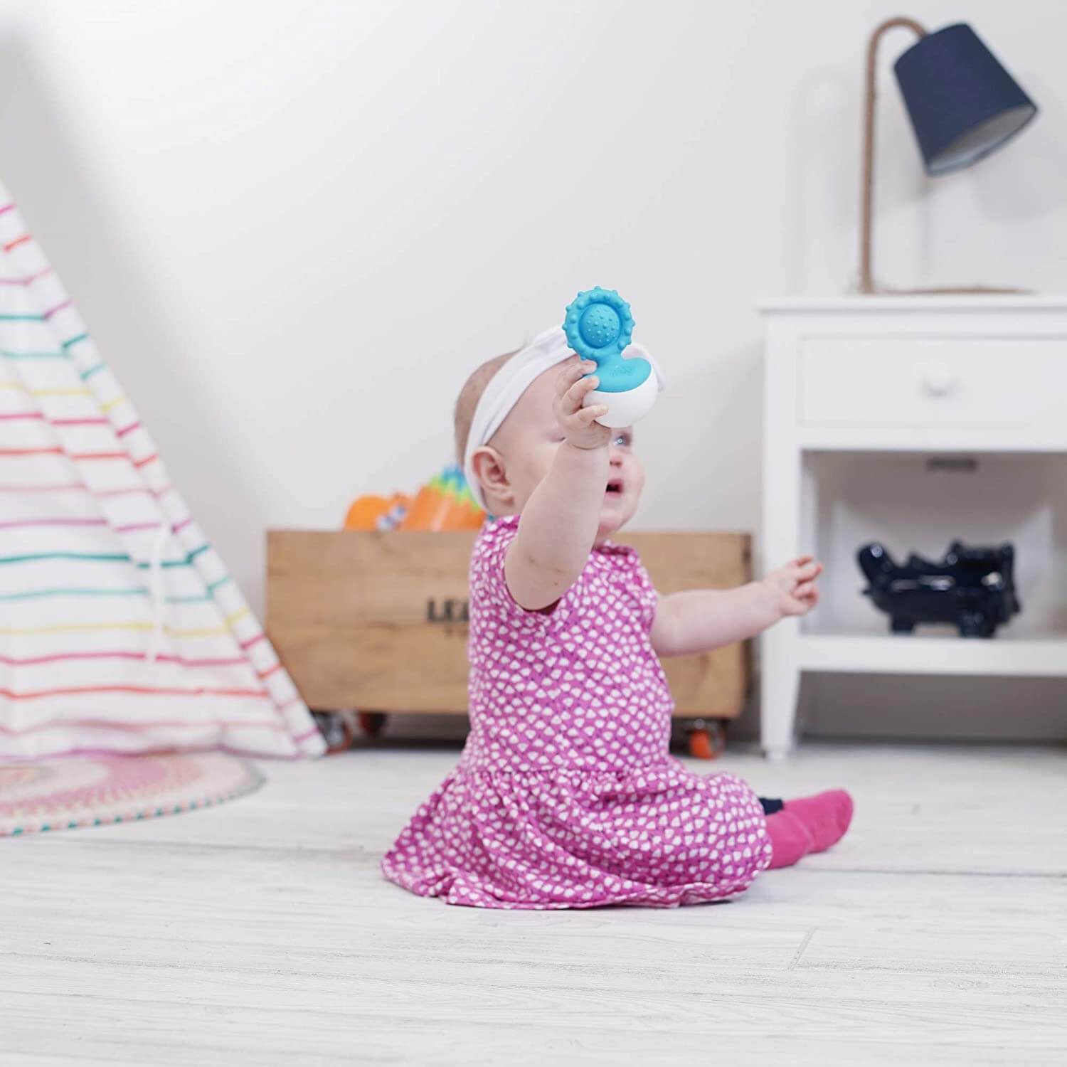 Baby playing with the toy.