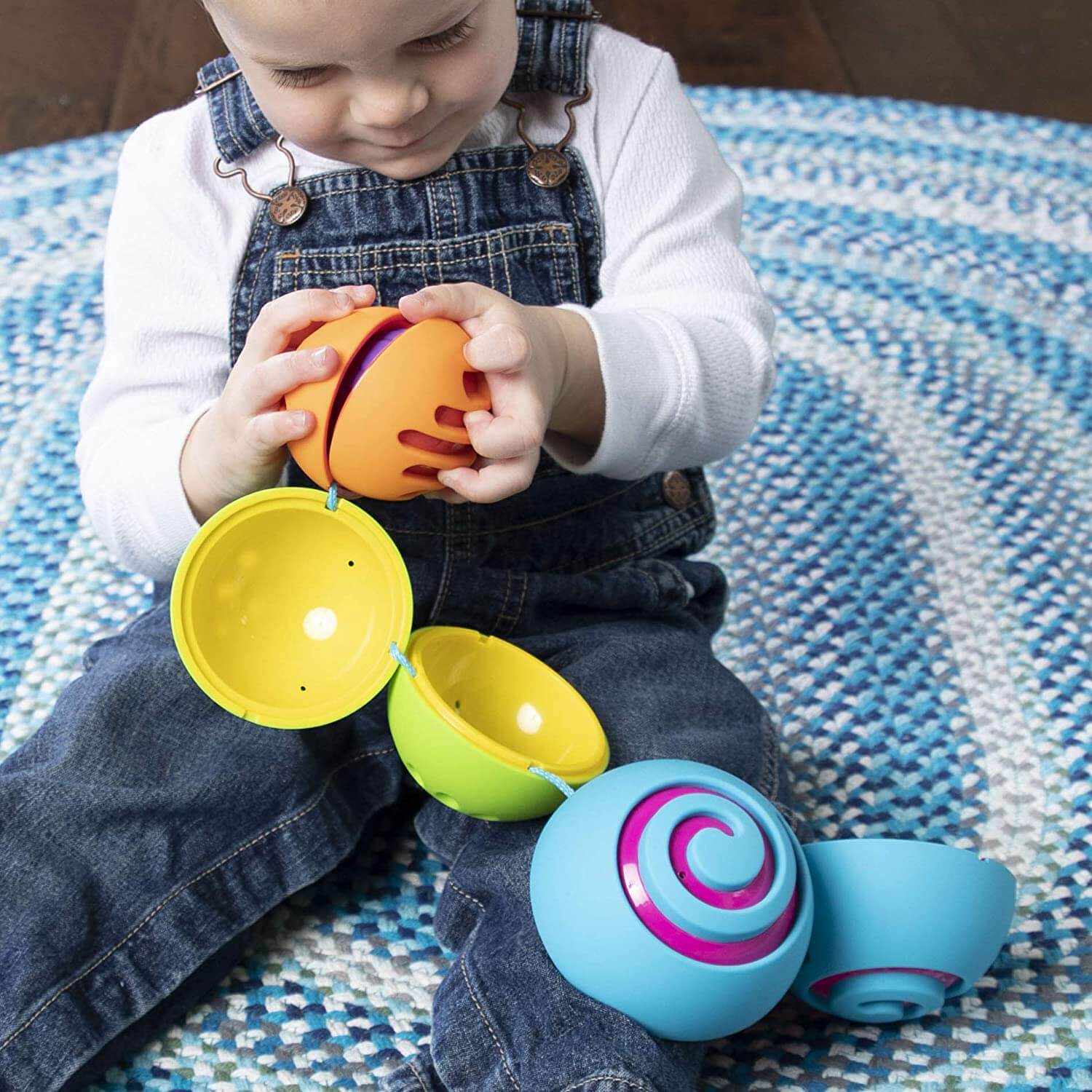 Baby playing with the toy.
