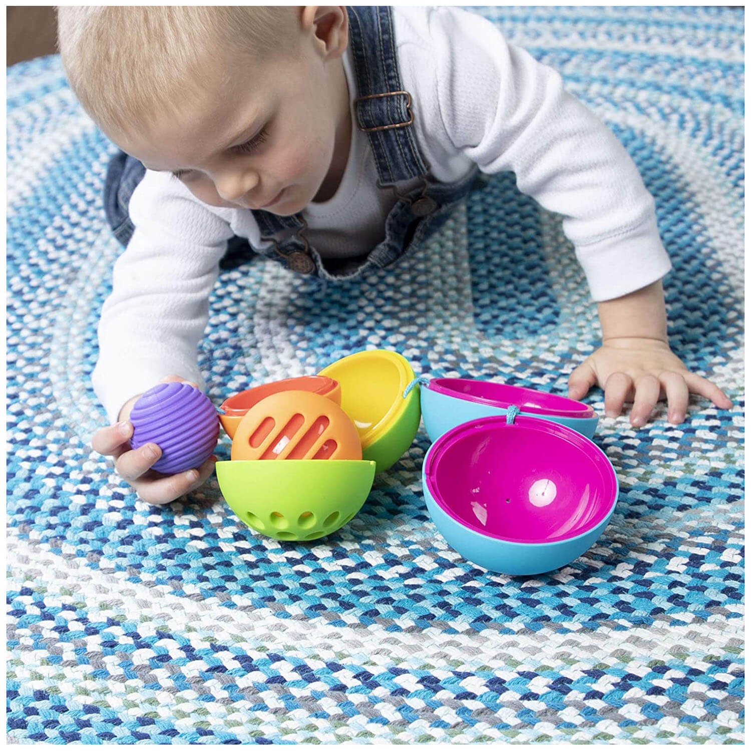 Baby playing with the toy.