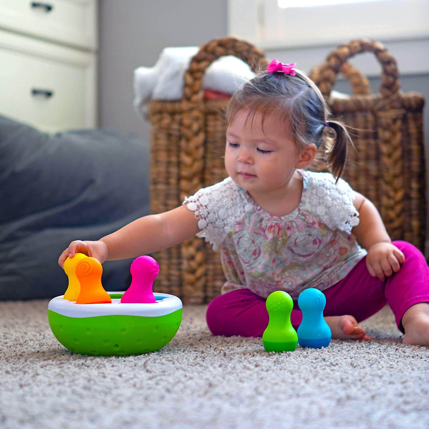 Baby playing with the toy.