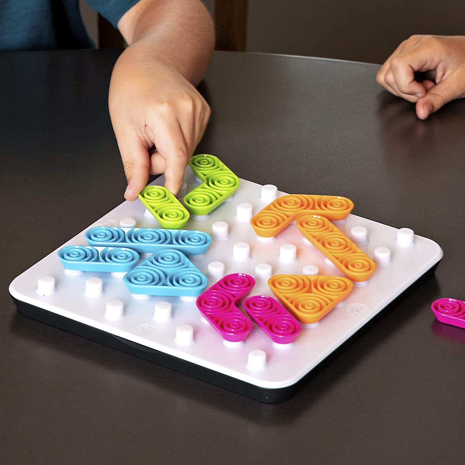 Hands playing the game.