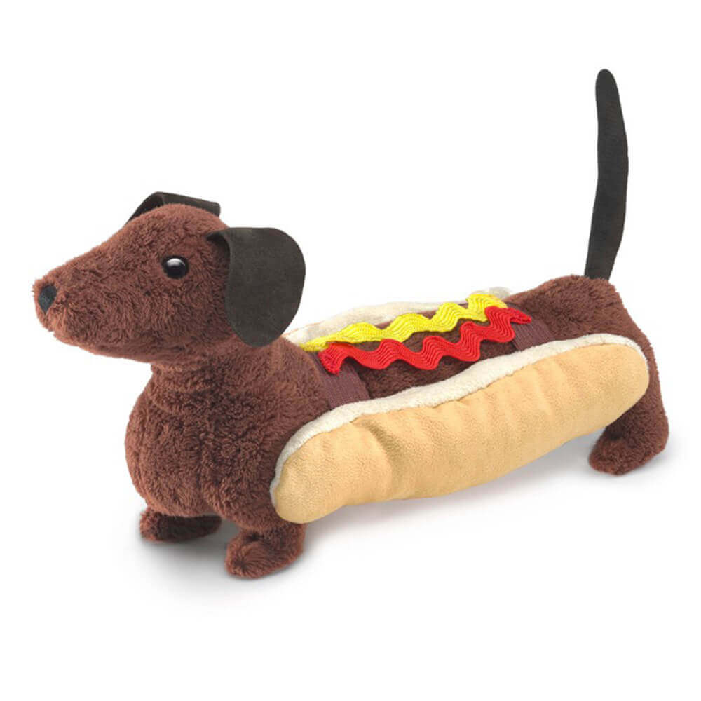Folkmanis Hot Dog Finger Puppet front view. It shows the brown dachshund puppet in a removable bun, ketchup, and mustard.