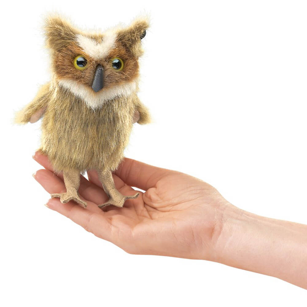 Front view of the Folkmanis Mini Great Horned Owl Finger Puppet, being held by a hand.