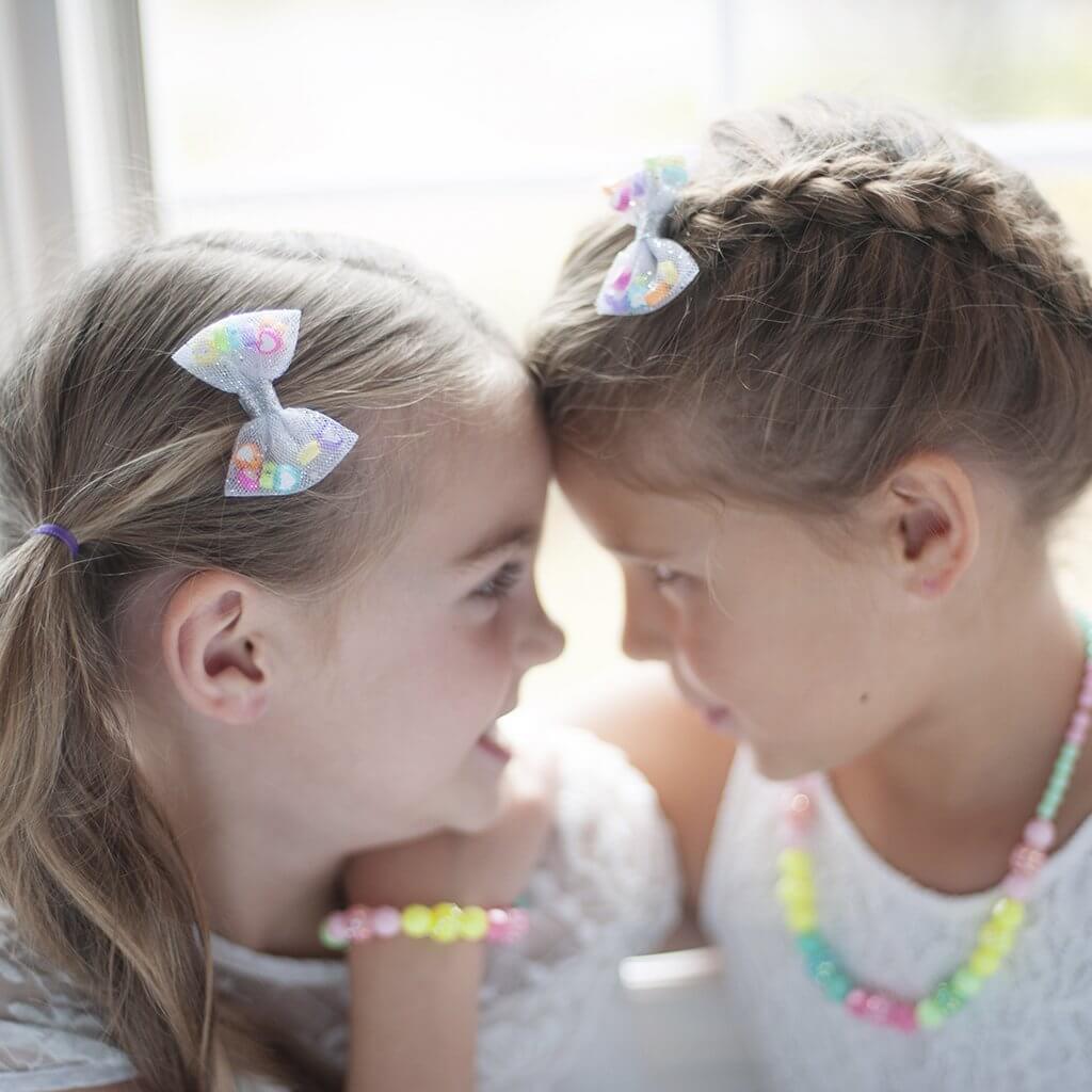 Front view of kids wearing the hair clips.