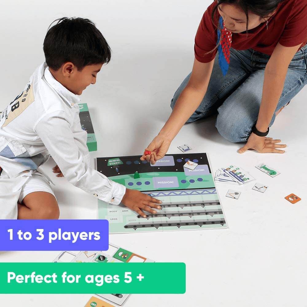 Boy and parent playing OjO Robot Workshop game for 1 to 3 players and perfect for ages 5 and older.